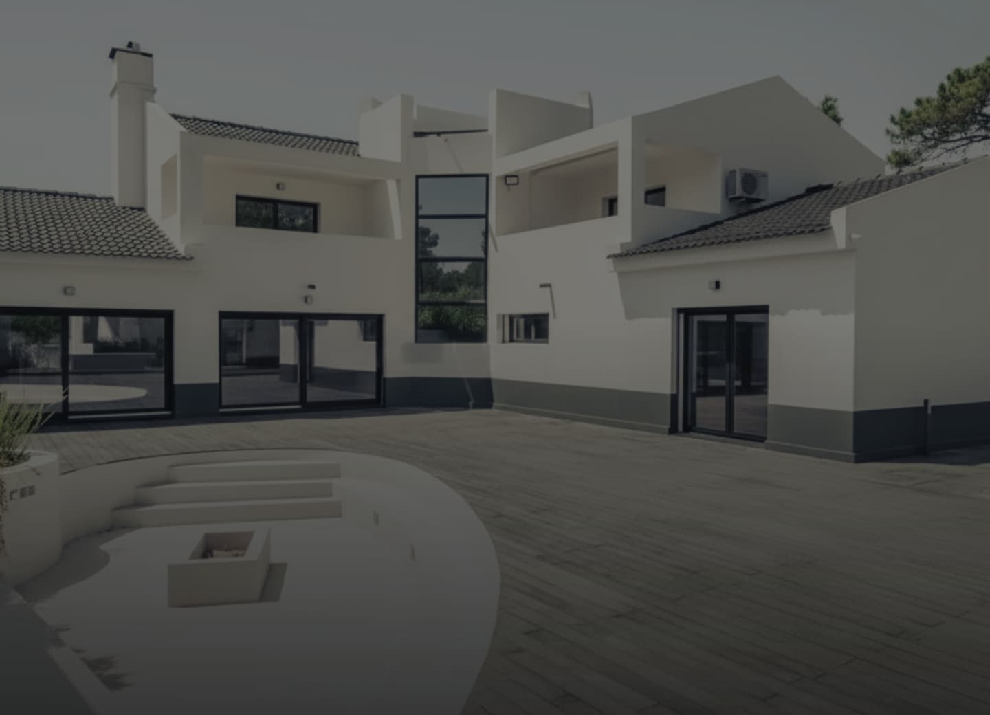 Exterior lounge with the sunken fire pit and the terrace