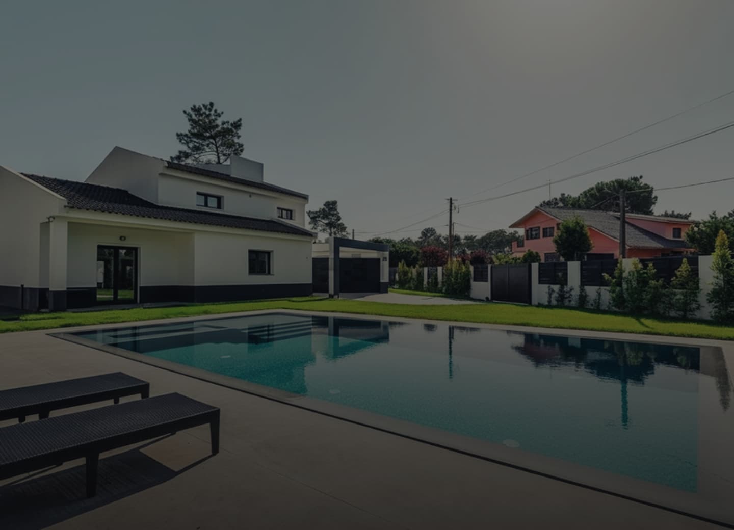 The CMPWND swimming pool and sun deck with the house behind