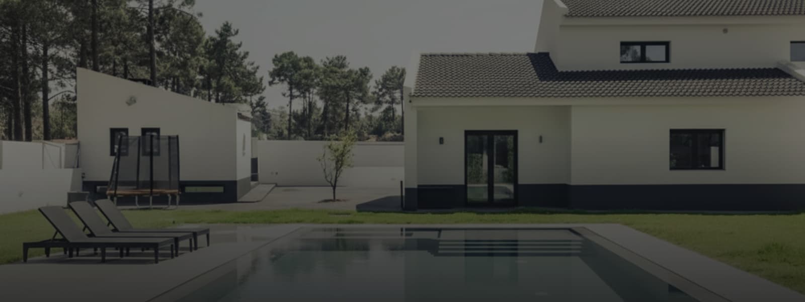 The pool with the house behind it